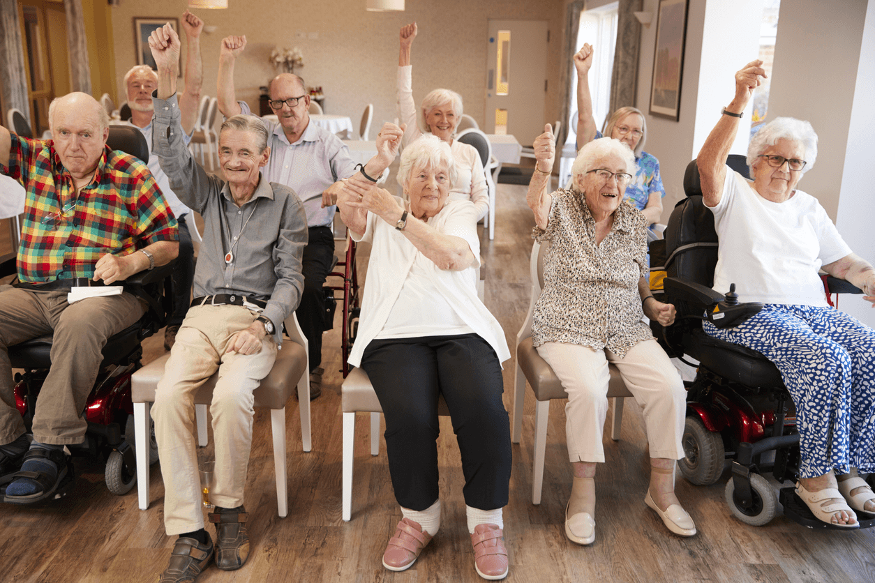 Happy seniors in a retirement home playing a game